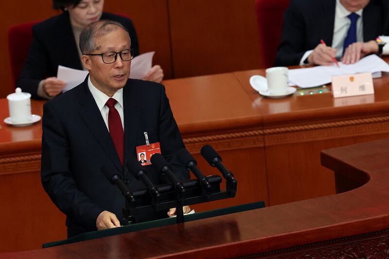 2024年3月5日,中国第十四届全国人大第二次全体会议在北京人民大会堂开幕,人大常委会副委员长李鸿忠作关于国务院组织法修订草案的说明。(路透社)